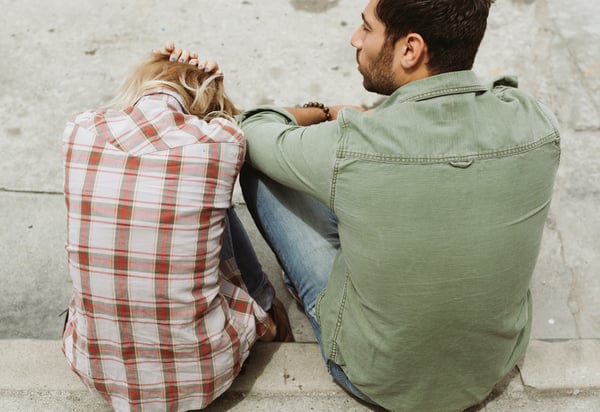 cover photo shows a man and a woman sitting next to each other